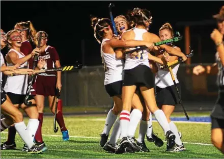  ?? BILL RUDICK — FOR DIGITAL FIRST MEDIA ?? Downingtow­n West celebrates its overtime game-winner by Romea Riccardo Monday night against Conestoga.