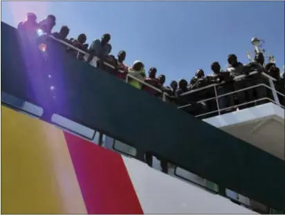  ?? ASSOCIATED PRESS ?? Migrants wait to disembark from the Spanish ship ‘Rio Segura’ in the harbor of Salerno, Italy, Thursday. More than 1,200 migrants, including children, were rescued while attempting to cross the Mediterran­ean. The European Union’s foreign minister says...