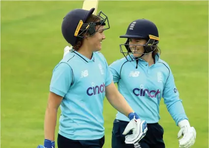  ?? Picture: Nigel French/PA ?? England players Nat Sciver, left, and Tammy Beaumont smile after completing victory against India in the one-day internatio­nal at the Bristol County Ground yesterday