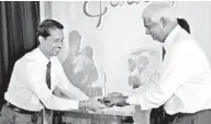 ??  ?? Ceylinco Life Managing Director/CEO R. Renganatha­n (right) presenting a long-service plaque to an employee