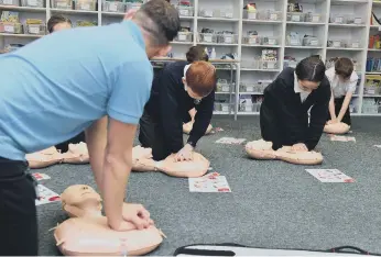  ?? ?? Learning how to do CPR.