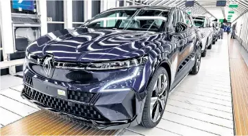  ?? ?? The Megane E-Tech made by Renault. The French company, like Volvo of Sweden, is scaling back on its electric vehicle dream