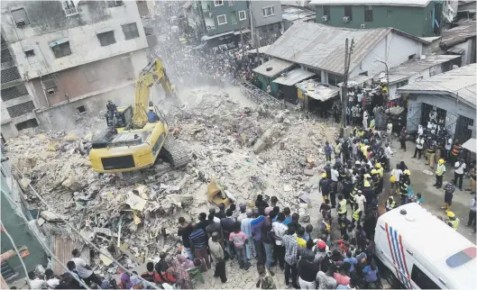  ?? Picture: AFP ?? COLLAPSE. A rescue worker operates a bulldozer in the search for bodies in the rubble of a collapsed building in Lagos, Nigeria, yesterday. Eight people were confirmed dead by officials and 15 were rescued after the four-storey building collapsed.