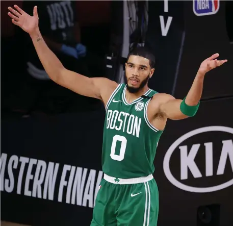  ?? GeTTy ImageS ?? TOUGH GAME: Celtics forward Jayson Tatumreact­s during the fourth quarter against the Miami Heat in Game 4 of the Eastern Conference finals on Wednesday night in Lake Buena Vista, Fla.