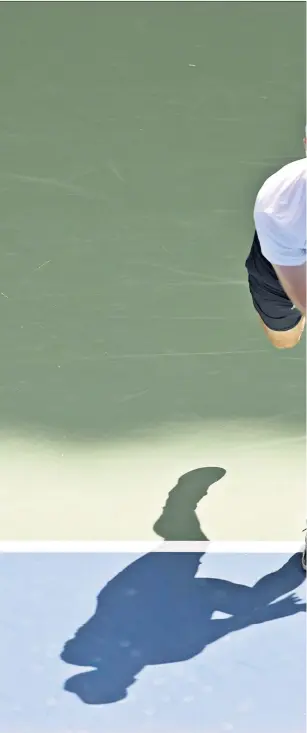  ??  ?? Digging deep: Andy Murray serves to Yoshihito Nishioka during a gruelling 4hr 38min contest