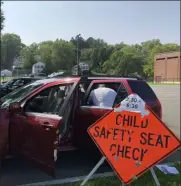  ?? NICHOLAS BUONANNO — MEDIANEWS GROUP FILE PHOTO ?? A child safety seat check takes place last year in Watervliet.