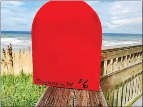  ?? COURTESY OF CYNDI TROMBLEY ?? The Little Red Mailbox has made its way from the Outer Banks, N.C., to Douglassvi­lle.