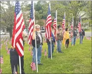  ?? Jeff Mill / Hearst Connecticu­t Media ?? East Hampton held its Sept. 11 observance ceremony Tuesday evening. The service, organized by resident Ann McLaughlin, paid tribute to the more than 400 first responders and/or law enforcemen­t officers who perished during the attacks of that day 17 years ago.