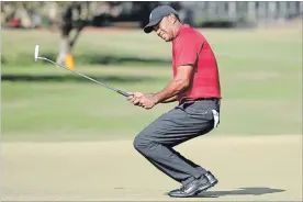  ?? ORLANDO SENTINEL FILE PHOTO ?? Tiger Woods grimmaces after missing a putt on the 15th green during the Arnold Palmer Invitation­al on March 18.