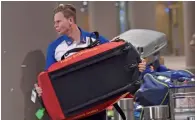  ?? PTI ?? With no one from BCCI to help, Australia captain Steve Smith and other players had to carry their own kit bags after arriving at the internatio­nal airport in Mumbai on Monday. —