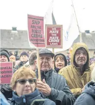  ?? ?? Campaigner­s gather outside the Scottish Parliament