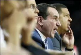  ?? MICHAEL DWYER — THE ASSOCIATED PRESS FILE ?? File- This file photo shows Duke head coach Mike Krzyzewski yelling instructio­ns from the bench during the first half of an NCAA college basketball game against Boston College in Boston. Krzyzewski isn’t interested in thinking about how his latest...