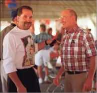  ?? Hearst Connecticu­t Media file photo ?? Gus Edwards, right, talks with former player Walter Belardinel­li of Danbury, class of ‘69, at Gus’ party at Hatters Park in Danbury, in 1997.