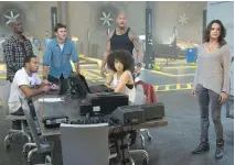  ?? UNIVERSAL PICTURES ?? Chris (Ludacris) Bridges, clockwise from bottom left, Tyrese Gibson, Scott Eastwood, Dwayne Johnson, Michelle Rodriguez and Nathalie Emmanuel star in The Fate of the Furious.