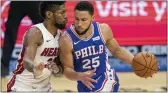  ?? CHREIS SZAGOLA - THE ASSOCIATED PRESS ?? Ben Simmons, right, drives against Miami’s Chris Silva Tuesday night at the Wells Fargo Center. Contrary to published reports, Simmons did not break NBA protocol and leave Brooklyn early, according to Sixers coach Doc Rivers.