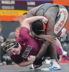  ?? SEAN D. ELLIOT/THE DAY ?? Montville’s Somuadina Agunyego, right, drives Killingly’s Connor LeDuc to the mat in the 285-pound match Wednesday night. Agunyego won by pin, but Killingly won the match 39-33.
