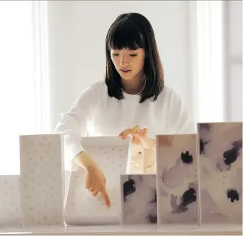  ?? SETH WENIG/THE ASSOCIATED PRESS ?? Declutteri­ng guru Marie Kondo has unveiled her new line of storage boxes. “These are meant to enhance your experience of the KonMari Method,” she says.