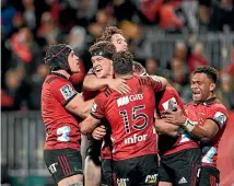  ?? GETTY IMAGES ?? The Crusaders, seen here celebratin­g after scoring a try against the Highlander­s on Friday night, look virtually unbeatable at home.