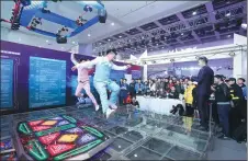  ?? PHOTOS PROVIDED TO CHINA DAILY ?? Two dancers display their skills on the footboard of the E5 Dance machine in the finals of the 2017 China Electronic Game Super League in Wuhan, Hubei province, in November.