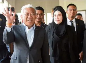  ??  ?? Day in court: Bung Moktar and Zizie leaving after being charged at the Kuala Lumpur court in Jalan Duta.