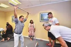  ?? Clint Egbert/Gulf News ?? BeStrong fitness trainers advise employees on health and exercise during the campaign at Gulf News office in Dubai.