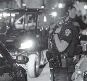  ?? DANIEL A. VARELA dvarela@miamiheral­d.com ?? Miami Beach Police arrive on the scene to disperse a crowd that formed near Seventh Street and Alton Road after crowds were sent away from Ocean Drive on March 21, 2021.