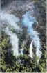  ?? PHOTO: OTAGO RURAL FIRE AUTHORITY. ?? A helicopter drops water on the blaze near Rat Point last week.