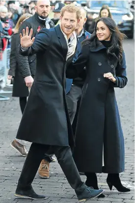  ?? Picture: AFP ?? Britain’s Prince Harry and his fiancée, US actress Meghan Markle, greet well-wishers on their first engagement as a couple — a walkabout in Nottingham, central England, on Friday.