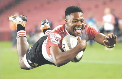  ?? Picture: Gallo Images ?? SOARING. Golden Lions replacemen­t centre Wandisile Simelane dives over to score his try against Griquas during their Currie Cup match at Ellis Park on Friday night.