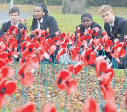  ??  ?? FIELD OF HOPE: Students at St Paul’s Catholic School, Leicester, have been making and planting poppies