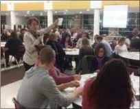  ?? EVAN BRANDT — DIGITAL FIRST MEDIA ?? Perkiomen Valley Schools Superinten­dent Barbara Russell instructs a crowd of more than 100 residents about how to fill out the priority survey during Wednesday night’s special meeting.