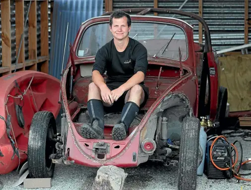  ?? JOHN BISSET/STUFF ?? Sam Pierce and his 1967 VW Beetle he started restoring during lockdown. Events mean the project is on the backburner.