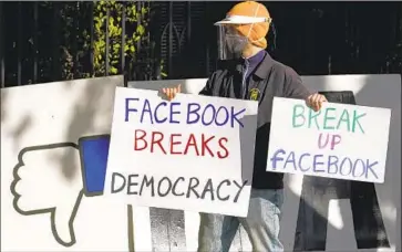  ?? Jeff Chiu Associated Press ?? FACEBOOK CEO Mark Zuckerberg has acknowledg­ed that content that flirts with violating site policies received more engagement in the form of clicks, likes and shares. Above, a protest outside his home in 2020.