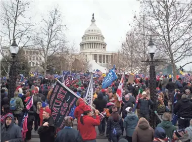  ?? JERRY HABRAKEN/USA TODAY ?? Rioters storm the U.S. Capitol on Jan. 6 as lawmakers inside debated the certificat­ion of the presidenti­al election. Questions remain about how rioters coordinate­d their attack.