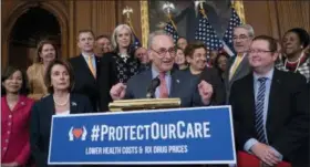  ?? AP PHOTO/J. SCOTT APPLEWHITE ?? In this May 15 file photo, Senate Minority Leader Chuck Schumer, D-N.Y., center, with House Speaker Nancy Pelosi, D-Calif., left, rallies House and Senate Democrats ahead of a House floor vote on the Health Care and Prescripti­on Drug Package, at the Capitol in Washington. Health care is on the agenda for Congress when lawmakers return, and it’s not another battle over the Obama-era Affordable Care Act. Instead of dealing with the uninsured, lawmakers are trying to bring down costs for people who already have coverage.