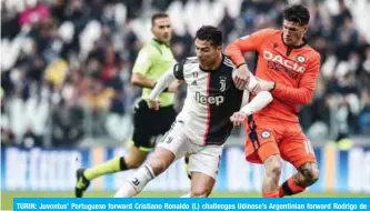  ?? — AFP ?? TURIN: Juventus’ Portuguese forward Cristiano Ronaldo (L) challenges Udinese’s Argentinia­n forward Rodrigo de Paul during the Italian Serie A football match Juventus vs Udinese at the Juventus Allianz stadium in Turin.