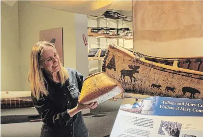  ?? CANADIAN CANOE MUSEUM ?? Karen Taylor, director of programs, displays a birchbark makak (basket), one of the many Indigenous innovation­s featured in the museum’s new virtual tours for seniors program.