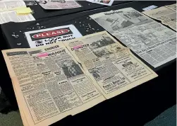  ?? ELEANOR WENMAN/STUFF ?? Old newspaper clippings of the Wahine disaster, at Muritai School. What would Facebook have reported of that disaster?