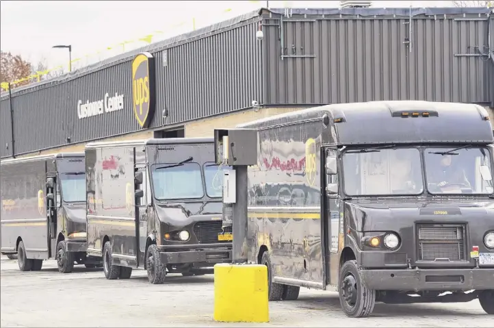  ?? Paul Buckowski / Times Union ?? UPS drivers head out from the Latham terminal to make deliveries. There are more jobs available in transporti­ng packages this holiday season and fewer in traditiona­l seasonal positions in brick-and-mortar stores.