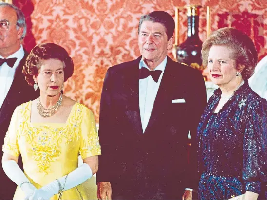  ??  ?? POWER: The Queen, Ronald Reagan and Margaret Thatcher at Buckingham Palace, prior to a dinner for summit leaders in 1984.