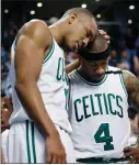  ?? AP PHOTO BY MICHAEL DWYER ?? Boston Celtics’ Avery Bradley (0) hugs teammate Isaiah Thomas (4) after the Celtics defeated the Washington Wizards 123-111 in a secondroun­d NBA playoff series basketball game, Sunday, in Boston.