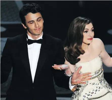  ?? GABRIEL BOUYS/GETTY IMAGES ?? Actors James Franco, left, and Anne Hathaway were roasted after hosting the Oscars together in 2011.