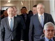  ?? AP ?? Australian Treasurer and new leader of the Liberal Party Scott Morrison, right, and new deputy leader Josh Frydenberg walk through Parliament’s precincts after the Liberal leadership vote.