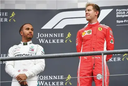  ?? Picture: AFP ?? ENVIOUS? Lewis Hamilton (left) has questioned Ferrari’s superior speed after Sebastian Vettel romped to victory at the Belgian Formula One Grand Prix at Spa-Francorcha­mps on Sunday.