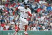  ?? WINSLOW TOWNSON — ASSOCIATED PRESS ?? The Red Sox’s Mookie Betts runs out a hit against the Blue Jays during the ninth inning July 14 in Boston.