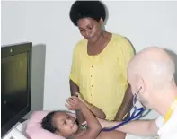  ?? Photo: Ronald Kumar ?? A Ben Anderson Pediatric Cardiologi­st together with Sai Prema Foundation checks on eight-year-old Bereta Delaiwelag­i as her mother, Sai Tabua, looks on at Colonial War Memorial Hospital on April 13, 2018.