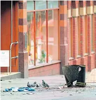  ?? Pictures: PETER BYRNE/PA & BBC ?? Debris scattered next to the remains of the litter bin after the Warrington bomb blast in March 1993