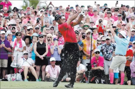  ?? Lynne Sladky ?? The Associated Press Tiger Woods, hitting from the third tee in Sunday’s final round of The Players Championsh­ip in Ponte Vedra Beach, Fla., will hold his annual Tiger Jam fundraiser this weekend in Las Vegas. The fundraiser benefits the Tiger Woods...