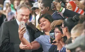  ?? AFP ?? Democratic vice-presidenti­al candidate US Senator Tim Kaine takes a selfie with a supporter during a campaign rally in Miami, Florida, on Saturday.