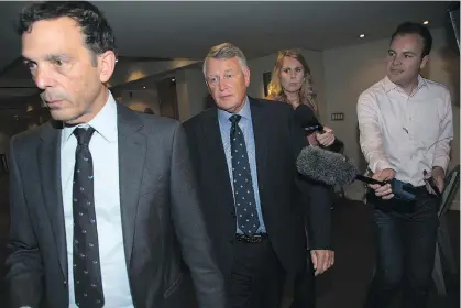  ?? TODD KOROL/THE CANADIAN PRESS ?? Federal Court Justice Robin Camp, centre, leaves a Canadian Judicial Council inquiry in Calgary last week. The council will decide whether Camp should be removed from the bench over his treatment of a teen accuser in a 2014 rape trail.